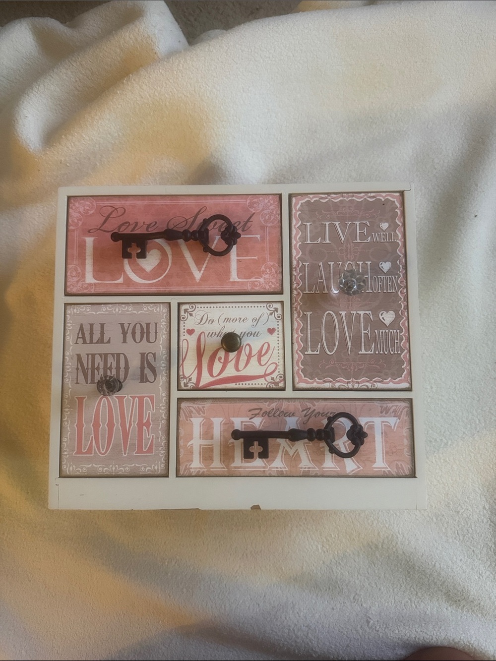 Love Themed Decorative storage box. Cream with different shades of faded reds.